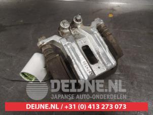 Nissan Pathfinder Bremszange links hinten O484776 foto 2
