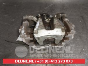 Toyota Corolla Bremszange links hinten O488480 foto 3