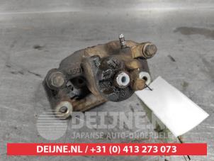 Mitsubishi Pajero Bremszange links hinten O497343 foto 3