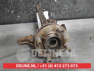 Nissan Micra Achsschenkel links vorne O497545 foto 2