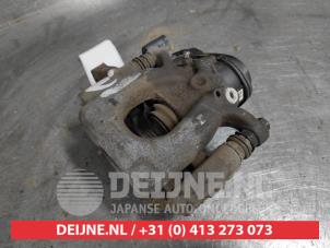 Nissan Qashqai Rear brake calliper, left O497612 photo 2