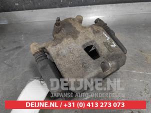 Subaru Legacy Bremszange links vorne O498435 foto 2