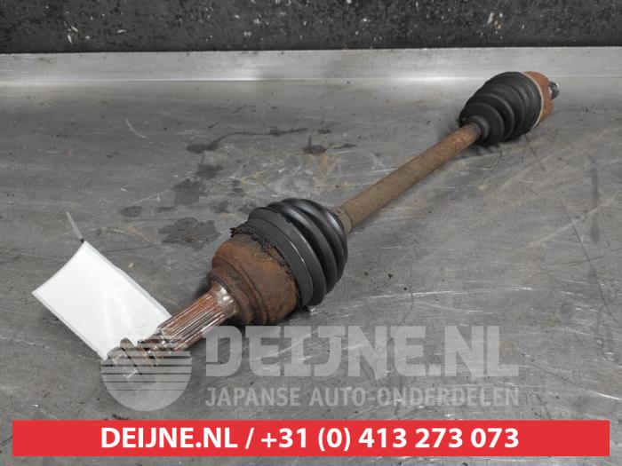 Nissan Micra Aandrijfas links-voor O499464