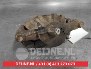 Toyota Corolla Bremszange links vorne O503645 foto 3