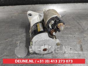 Startmotor van een Daihatsu Cuore (L251/271/276) 1.0 12V DVVT 2006