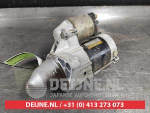 Startmotor van een Daihatsu Cuore (L251/271/276) 1.0 12V DVVT 2006
