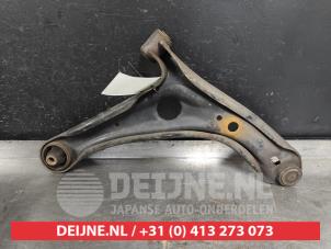 Toyota Yaris Querlenker unten links vorne O519389 foto 2