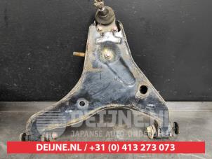 Mitsubishi L200 Front lower wishbone, left O520093 photo 2