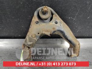 Mitsubishi L200 Front upper wishbone, right O540490 photo 2