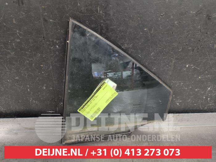 Nissan Primera Driehoeks Ruit links-achter O543956