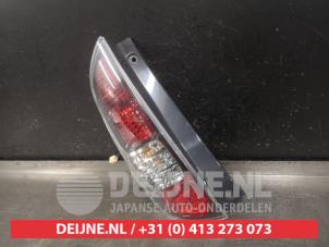 Daihatsu Sirion Rücklicht links O552255 foto 2