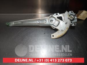 Daihatsu Cuore Fenstermechanik 4-türig links hinten O290773 foto 2
