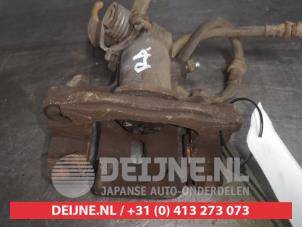 Hyundai Coupe Bremszange links vorne O559594 foto 2