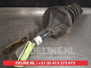 Kia Sportage Schokdemperpoot links-achter O560260 foto 2