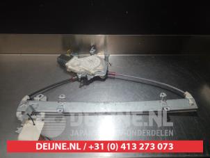 Nissan Micra Fenstermechanik 4-türig links vorne O275645 foto 2