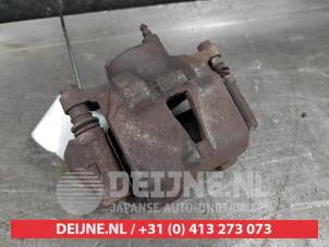 Toyota Yaris Front brake calliper, left O564369 photo 2