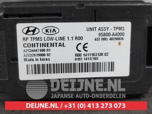 Kia Carens Bandenspanning module O565363 foto 2