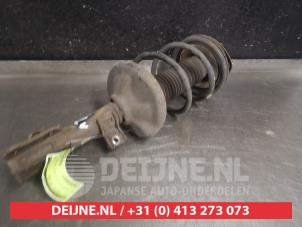 Suzuki Liana Stoßdämpferstrebe links vorne O566259 foto 2