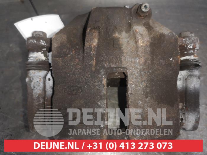 Hyundai Matrix Bremszange links vorne O568430