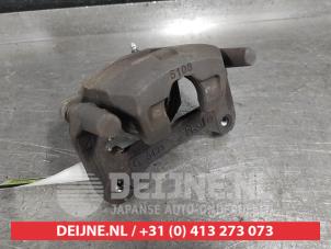 Mitsubishi Space Star Bremszange links vorne O574361 foto 2