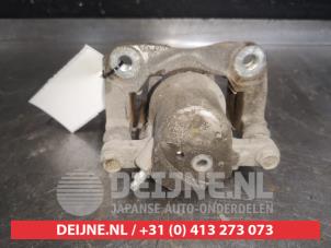 Toyota Rav-4 Bremszange links hinten O579738 foto 2