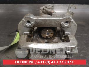 Suzuki SX-4 Bremszange links hinten O580804 foto 2