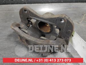 Hyundai IX35 Front brake calliper, left O581094 photo 2