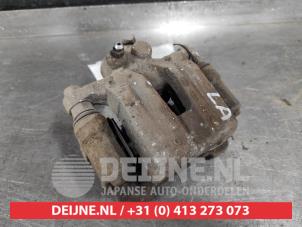Hyundai IX35 Rear brake calliper, left O581095 photo 2
