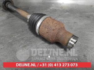 Subaru Justy Antriebswelle rechts vorne O581656 foto 2