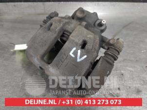 Mitsubishi Colt Front brake calliper, left O583428 photo 2