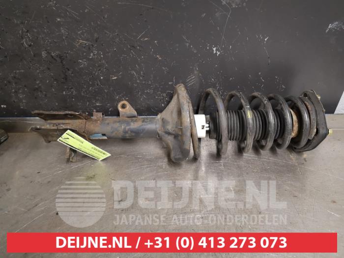 Hyundai Coupe Schokdemperpoot rechts-achter O586097