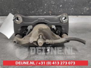 Mazda 3 Bremszange links vorne O587607 foto 2