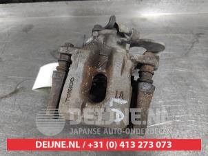 Toyota IQ Bremszange links hinten O593150 foto 2