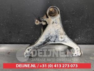 Nissan Navara Draagarm onder links-voor O596354 foto 2