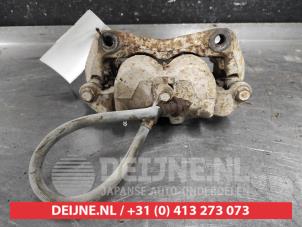 Nissan Navara Front brake calliper, left O596363 photo 2