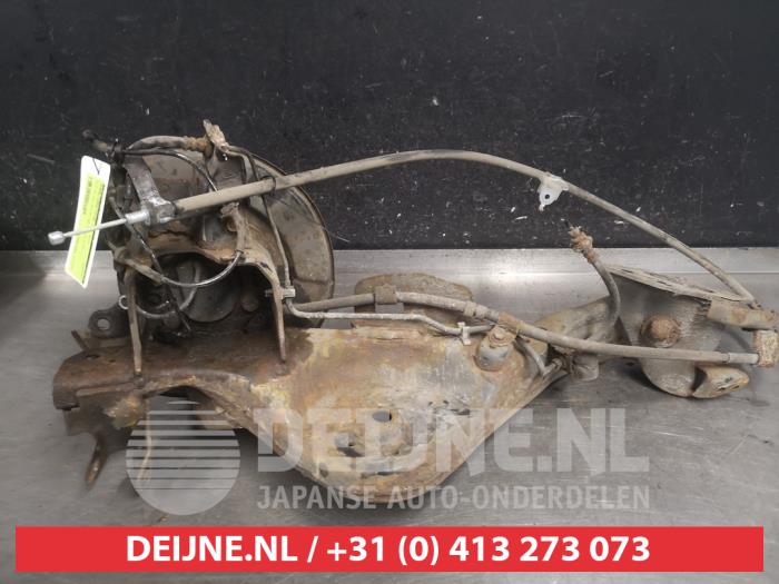 Nissan Qashqai+2 Fusee links-achter O597807
