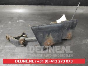 Suzuki Swift Xenon hoogteregelaar O599889 foto 2