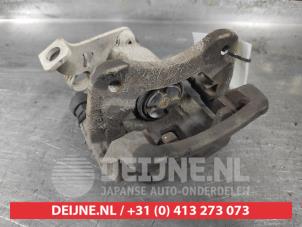 Kia Carens Bremszange links hinten O603540 foto 2