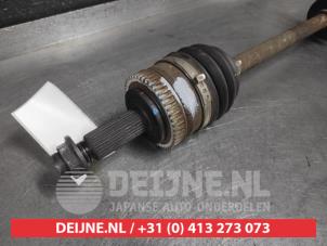 Kia Carens Aandrijfas links-voor O605722 foto 2