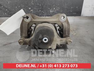 Kia Carens Front brake calliper, left O605724 photo 2