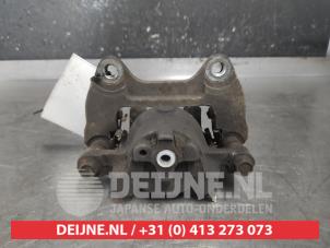 Daihatsu Sirion Front brake calliper, left O611028 photo 2