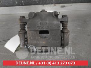 Daihatsu Sirion Front brake calliper, left O611028 photo 3