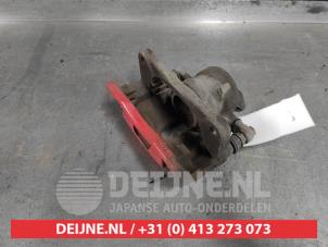 Suzuki Swift Front brake calliper, left O617371 photo 2