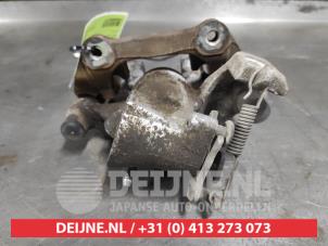 Toyota Yaris Rear brake calliper, left O618776 photo 2