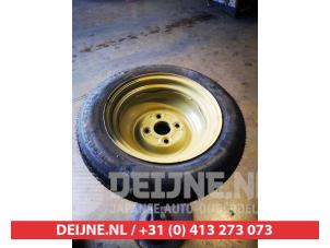 Daihatsu Cuore Space-saver spare wheel O619301 photo 2