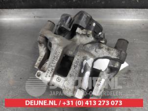 Mazda 3 Bremszange links hinten O619306 foto 2