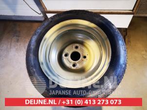 Daihatsu Cuore Space-saver spare wheel O625342 photo 2
