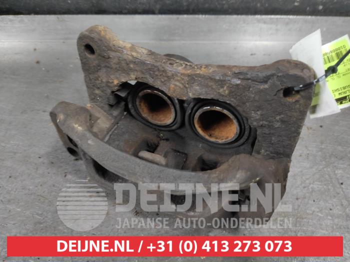 Mitsubishi Pajero Remklauw (Tang) links-voor O627858