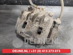 Subaru Legacy Bremszange links vorne O632502 foto 2