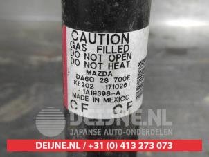 Mazda 2 Rear shock absorber, left O642843 photo 2